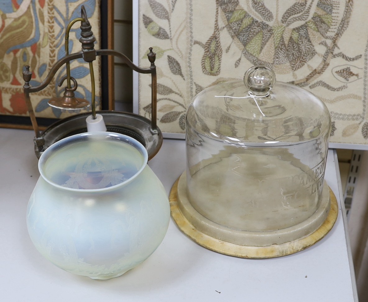 An embossed copper ceiling light with vaseline glass shade, and Far Famed Cake Co. cake stand and domed cover